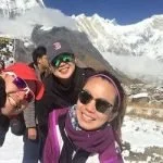 Guide taking selfie with his group at annapurna basecamp