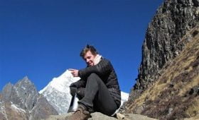 face of joe in the picture shows Langtang Valley Trek Difficulty, the picture is from the top of kyanjing ri, however.