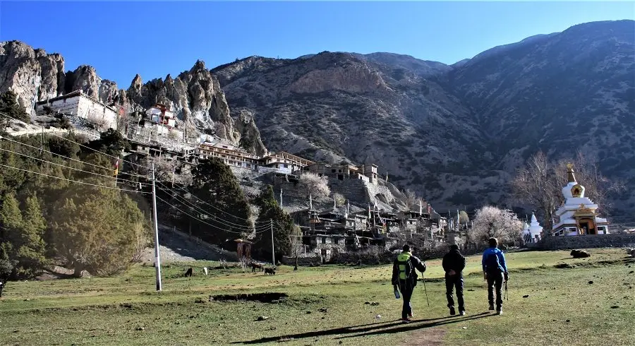 Trekkers walking towards Braka Monastery during Annapurna circuit tilicho lake trek