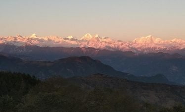 Wide mountain range of Chisapani village view point during sunset