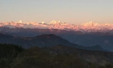 Wide mountain range of Chisapani village view point during sunset