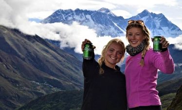 Denis girls with carlsberg beer infront of Mount Everest.
