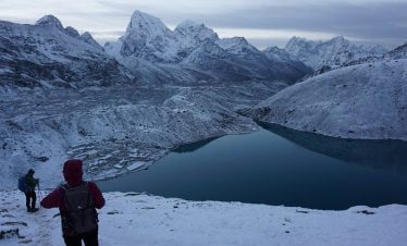 Trekkers trekking down from gokyo ri in the snowy morning