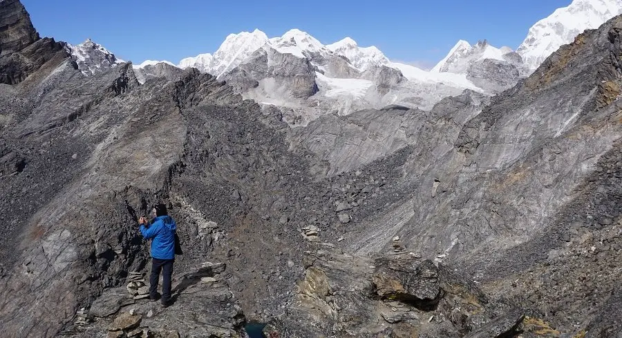 Rollo taking picture near the last pass, renjo la pass on his everest base camp 3high passes trekking adventure in everest