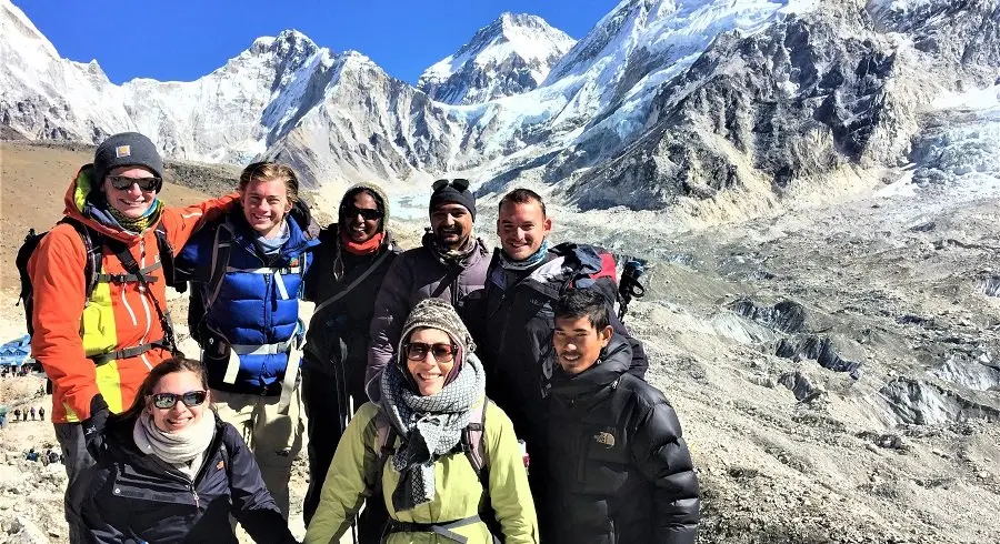 Everest 3 high pass trekking team posing right infront of Gorakshep village