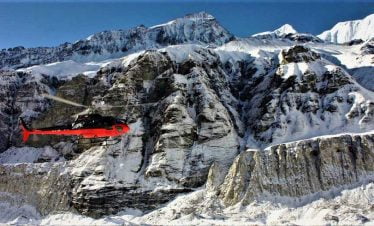 Helicopter taking passenger back to pokhara from Thorong las