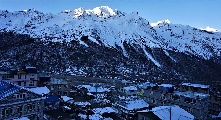 The last village of Kuyanjing gompa with sun rising at the top of Nayakang peak