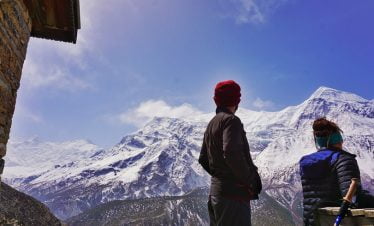 staring at the mountains from yak kharka while taking break on Round Annapurna trek