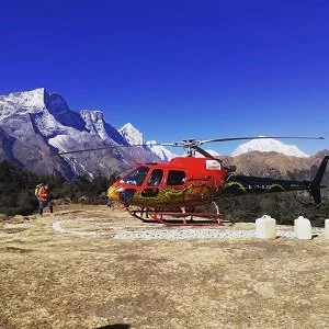 Helicopter landing infront of everest range in everest nepal luxury tour program