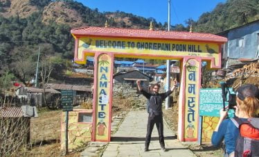 stewart excited at the gate of poonhill in his trekking tour in nepal