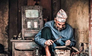Old man on his regular work captures on our lens of Bungmati Khokana Day tour