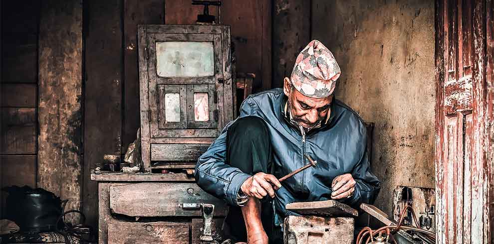 Old man on his regular work captures on our lens of Bungmati Khokana Day tour