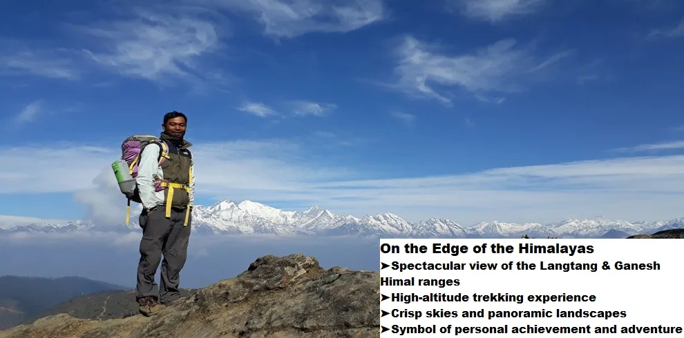 Gosaikunda Trek 2 Man standing on a ridge with snowy peaks in the background.