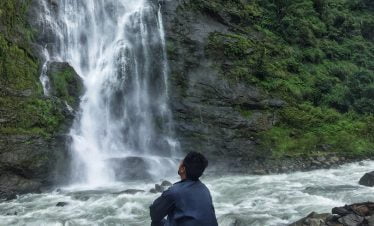 staring at the waterfall the tallest waterfall of the Helambu trek at Melamchi