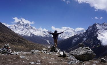 View of the himalaya and trekkers pose during jiri gokyo everest base camp trek