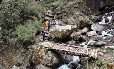 Wooden bridge before starting trekking through the jungle of Khopra ridge trek in nepal
