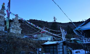 Centuries old chhorten and buddhist prayer flags