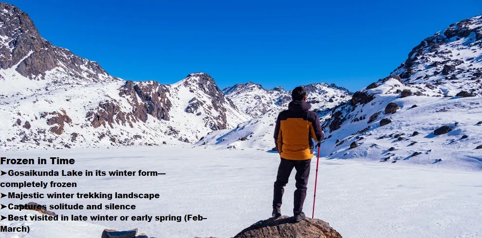 Gosaikunda Trek 4 Man facing a fully frozen gosaikunda lake, surrounded by snow.