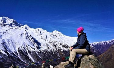 Taru looking at the Nayakang peak on her Tamang heritage trekking