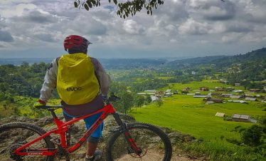 towards the finish line of chitalng cycling tour - staring at the village for a short break
