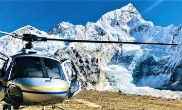 helicopter landing infront of Mount Everest in a luxury tour