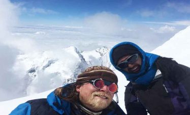 Arun and mark smiling at the summit of island peak
