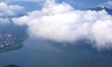 Pokhara and peace stupa seen from sarangkot on our Kathmandu pokhara lumbini tour
