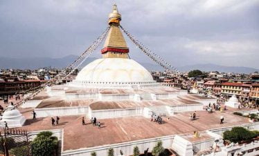 Boudhanath stupa seen in the evening from a restaurant rooftop on kathmandu 1 day tour lunch time