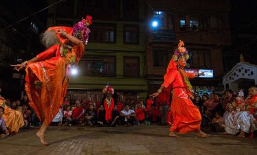 During the local festival - folks dancing with face mask and special dresses