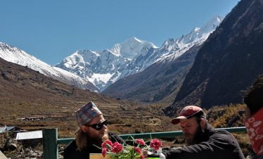 Happy boys with Nepali hat and viking look infront of Mt Dorje lakpa and langtang range