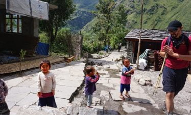 Kids greeting while trekking along the local villages