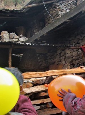 Happy tourist grumpy kid with balloon as their gift