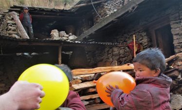 Happy tourist grumpy kid with balloon as their gift