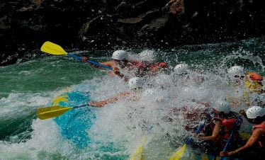 Nepal adventure tour participates enjoying the splash of water in trishuli river rafting