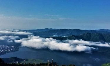 beauty of pokhara city, the lakes and the world peace stupa seen from sarangkot in Nepal chilling tour