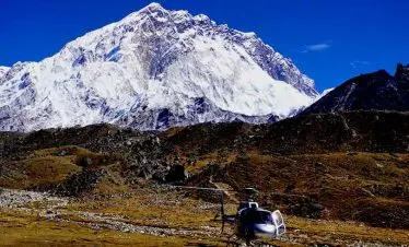 Helicopter refilling the gas infront of Mt Nuptse in our Everest nepal luxury tour
