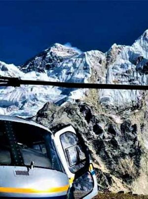 Helicopter infront of Everest while passengers are taking selfie with everest on their Nepal luxury tour