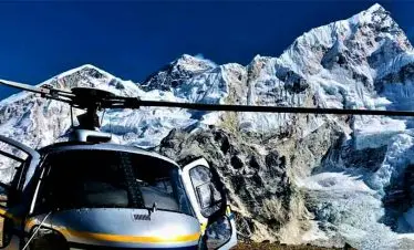 Helicopter infront of Everest while passengers are taking selfie with everest on their Nepal luxury tour