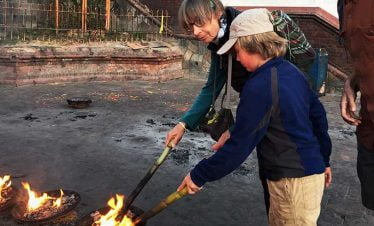 Martin and eliska getting involved in the spiritual activity in their Nepal tour