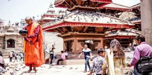 monk paying his respect to sun at patan