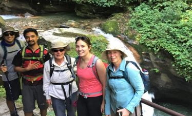 Near waterfall on family trek to Poon hill