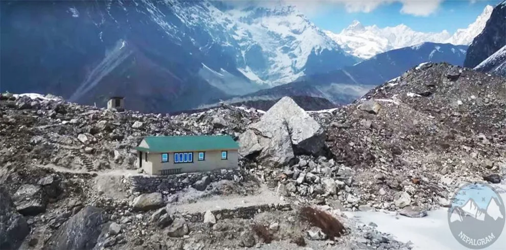 Between the stones and summits lies a humble building