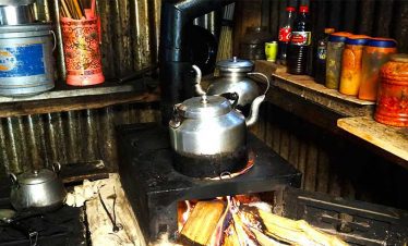 Local tea house on our trek to Limi valley with our tea being boiled