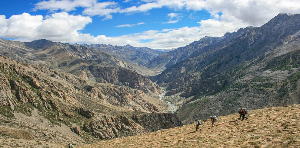 Trekkers push forward on the rugged trails of Nara La Pass