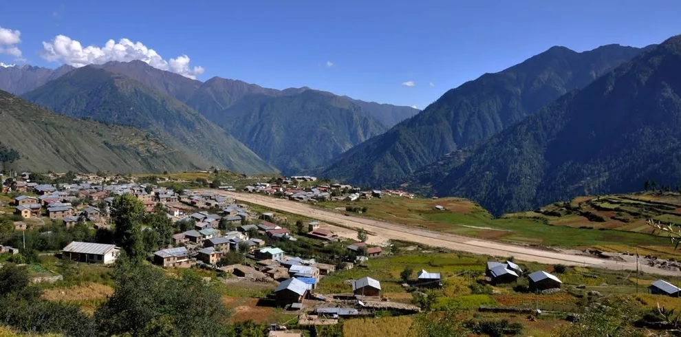 Talung Village sits peacefully amidst rolling green landscapes