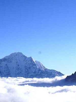 view of the moutanins above clouds
