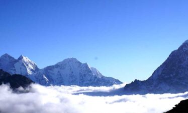 view of the moutanins above clouds