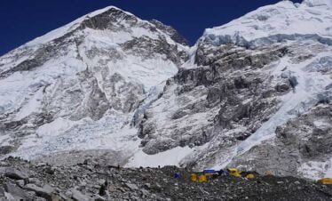 view of mount everest and the tents at the everest base camp - seen from everest basecamp itself