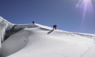 Climbers climbing to the summit of Pharchamo Peak