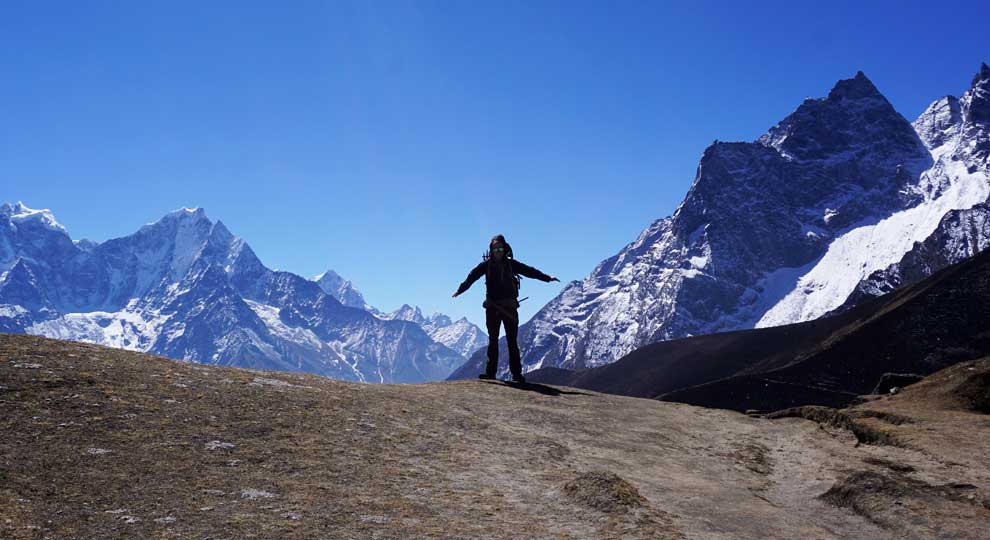 Excited to be infront of the mountains on his Gokyo renjola pass circuit trek in Nepal